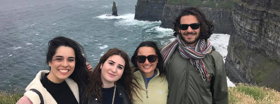 5 of 9, Four students posing in front of Cliffs of Moher