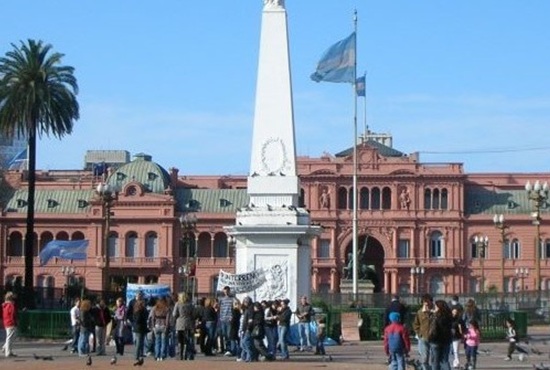 people around a monument